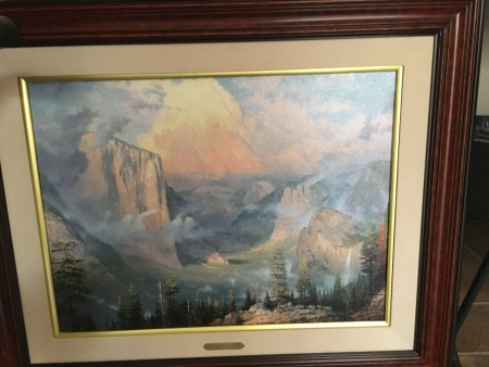 A Thomas Kinkade painting of Yosemite Valley.