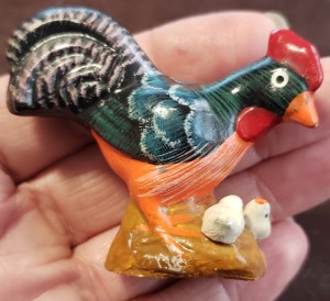 A painted rooster figurine.
