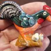 A painted rooster figurine.