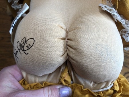 The marking on the backside of a Cabbage Patch doll.