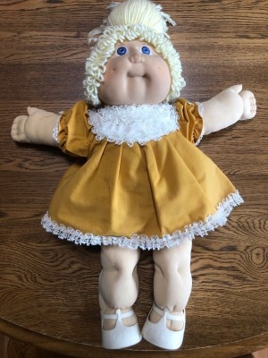 A blonde Cabbage Patch doll.