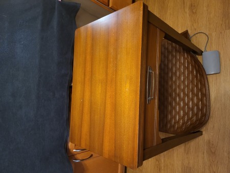 The closed sewing cabinet.