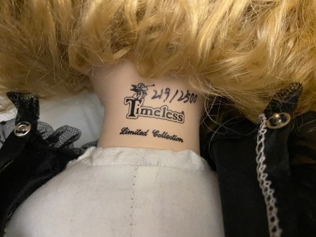 The markings on the back of a doll's neck.