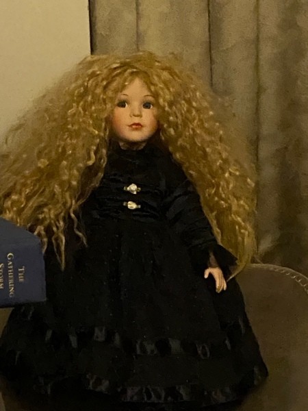 A doll with long blonde hair.