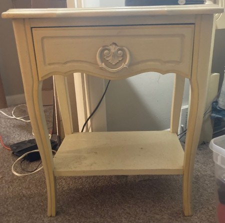 A white vintage nightstand.