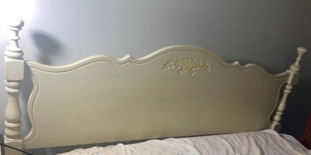 A white vintage headboard.