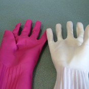A glove turned inside out next to a right side glove.