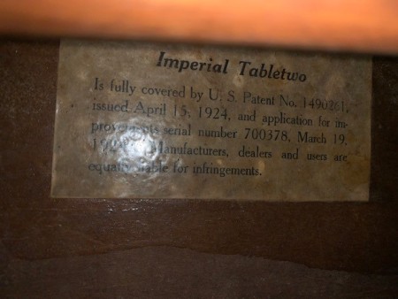 Information on the underside of a wooden table.