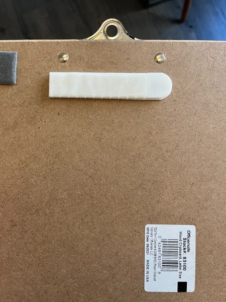 Attaching velcro to the back of the board.