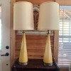 Two tall glass lamps.