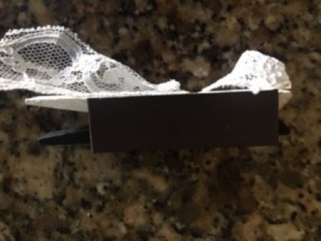 Adding lace to the white side of the clothespin.