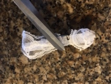 Adding lace to the white side of the clothespin.