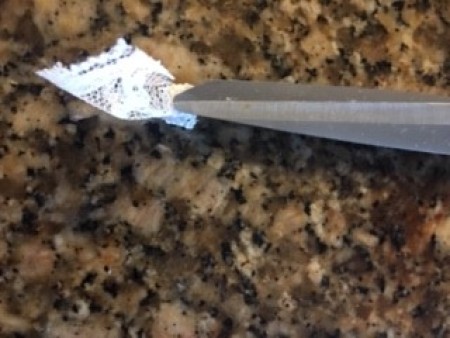 Cutting pieces of lace.