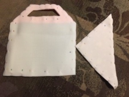 Pinning the fabric pieces together.