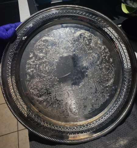 A round silver serving tray.
