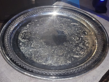 A round silver serving tray.