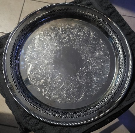 A round silver serving tray.