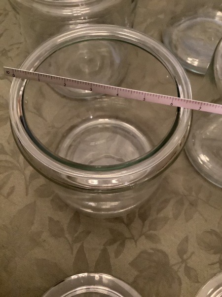 Measuring the width of a canister.