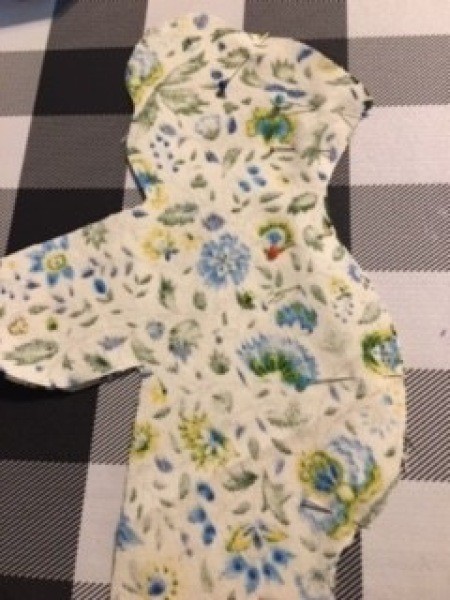 One side of the stuffed bear.