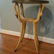 A side table with a decorative base.