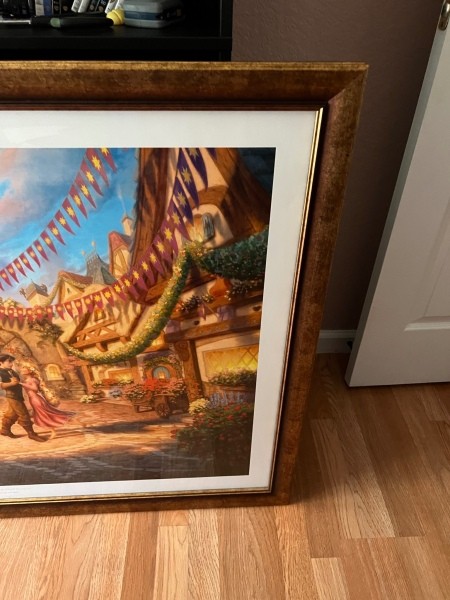 The top right corner of a framed print.