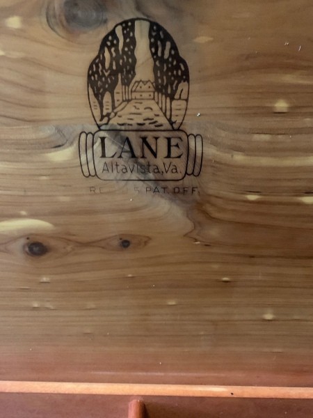 The manufacture's logo inside a cedar chest.
