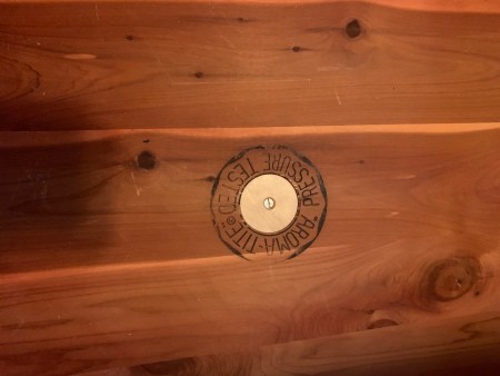 Inside the lid of a cedar chest.