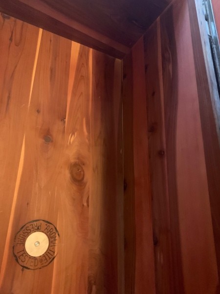 Inside the lid of a cedar chest.