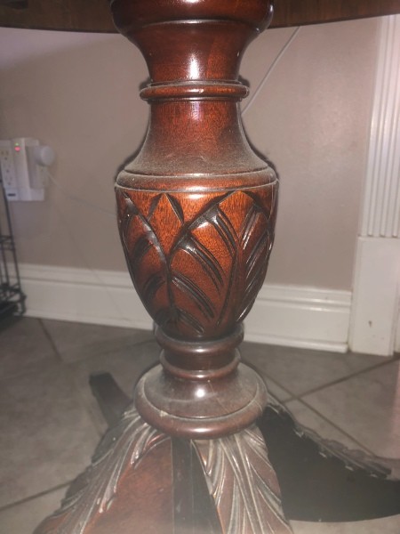 The carved base of a table.