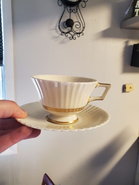 A china cup and saucer.