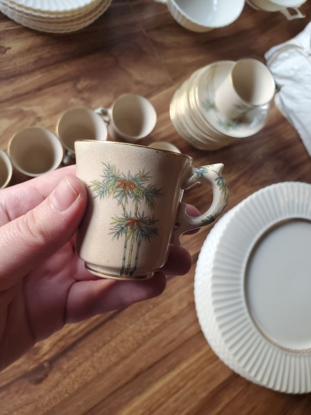 A small cup with a bamboo pattern.