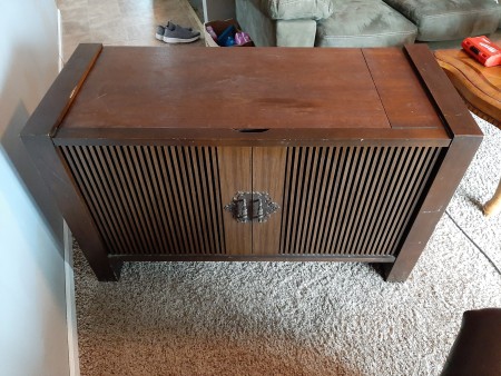 A stereo cabinet.