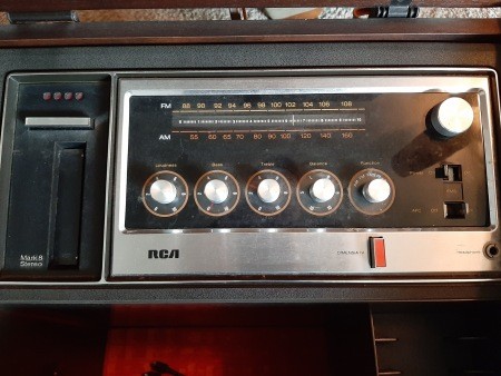 The controls in a stereo cabinet.