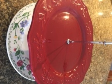 Stacking the plates on the hardware.