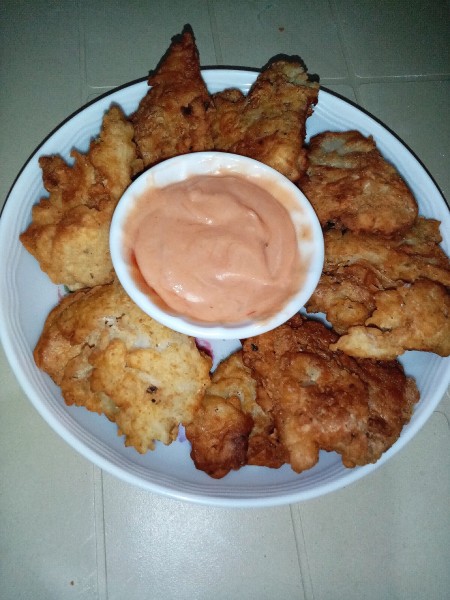 The completed crispy scrambled eggs with a dipping sauce.