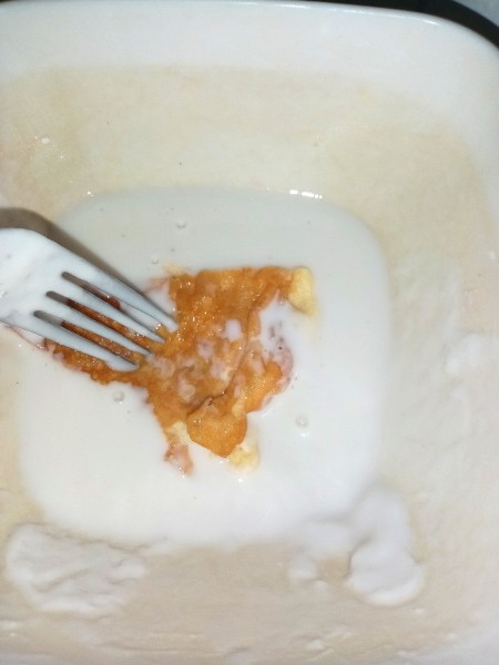 Dipping the egg sections in the mixture.