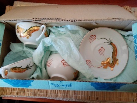 A set of china in a box.