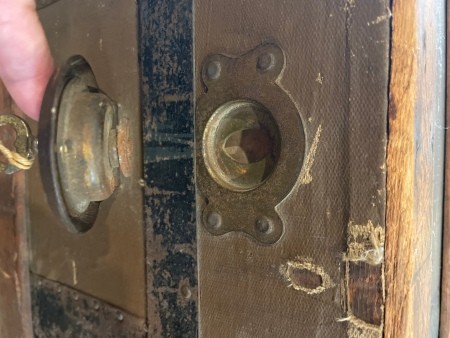 The lock on a steamer trunk.