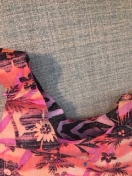 Turning the fabric inside out.