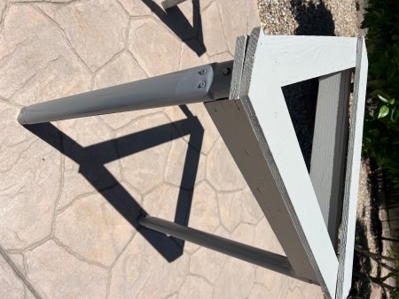 Attaching the post to the triangular structure.