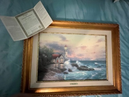 A Thomas Kinkade print.