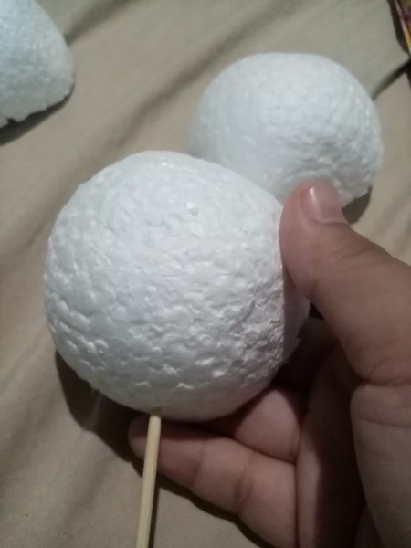 Attaching the skewer to styrofoam.