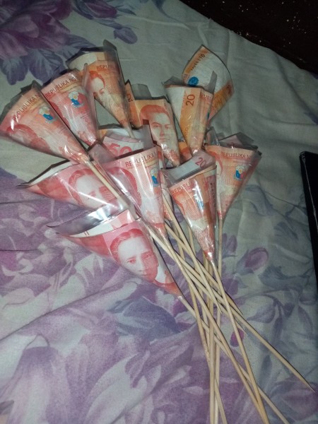 A collection of money on skewers.