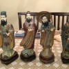A set of four Asian figurines.