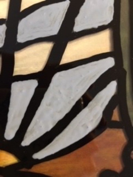 A close up of the painted glass.