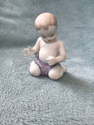 A figurine of a baby.