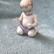 A figurine of a baby.