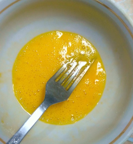 Beating egg mixture.