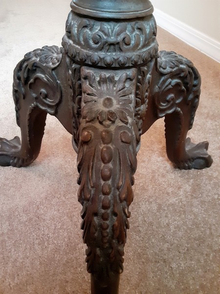 The ornate bottom of a table.