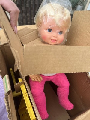 A baby doll with blonde hair.